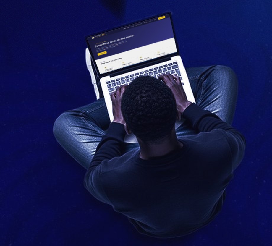 A student, seen from above, working on a laptop showing the Syspoint Hub website